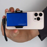 POWRIG MagSafe SSD Mount showing strong magnets snapping onto iPhone 15 Pro