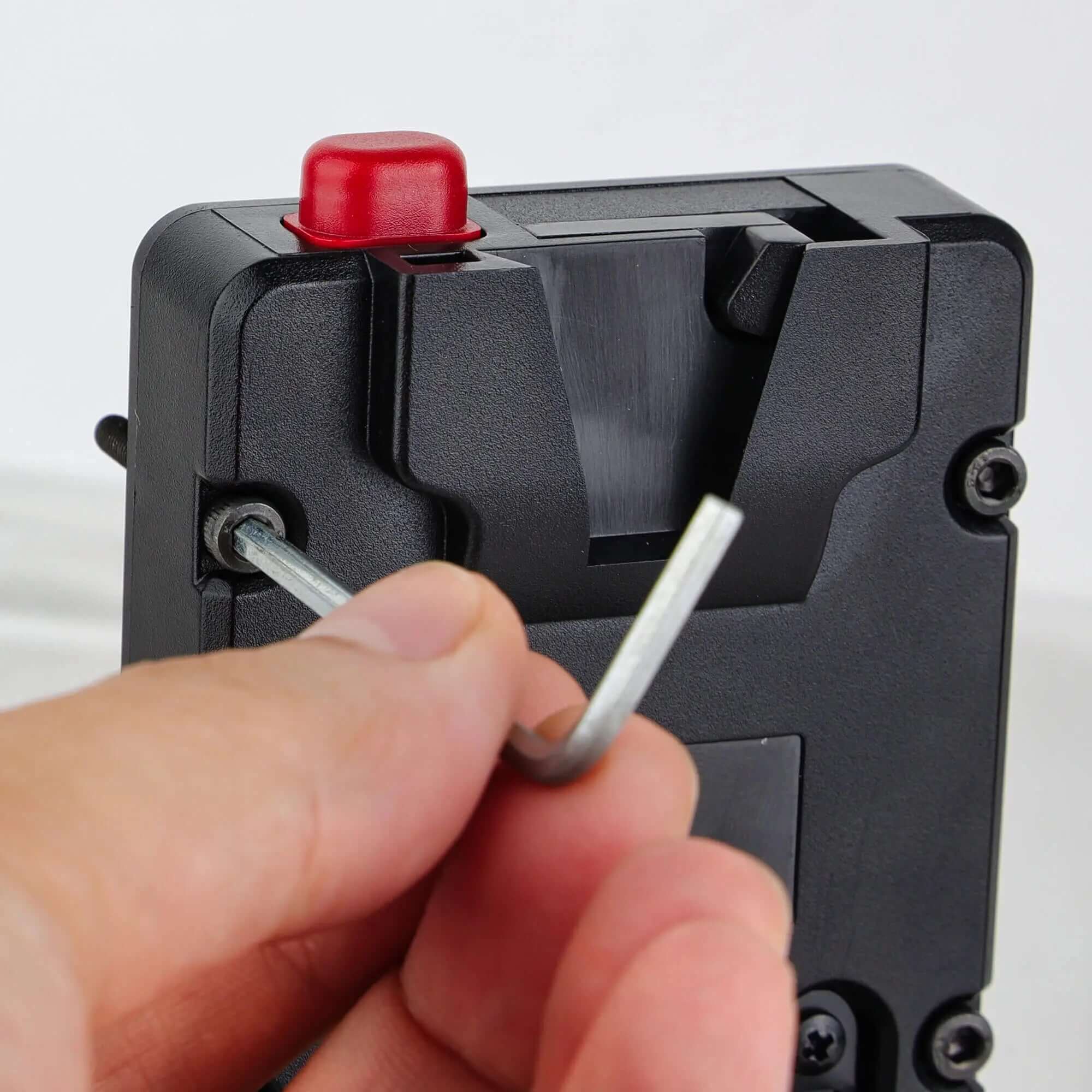 Allen wrench adjust mounting screws on POWRIG mini Vmount power plate for cinema camera
