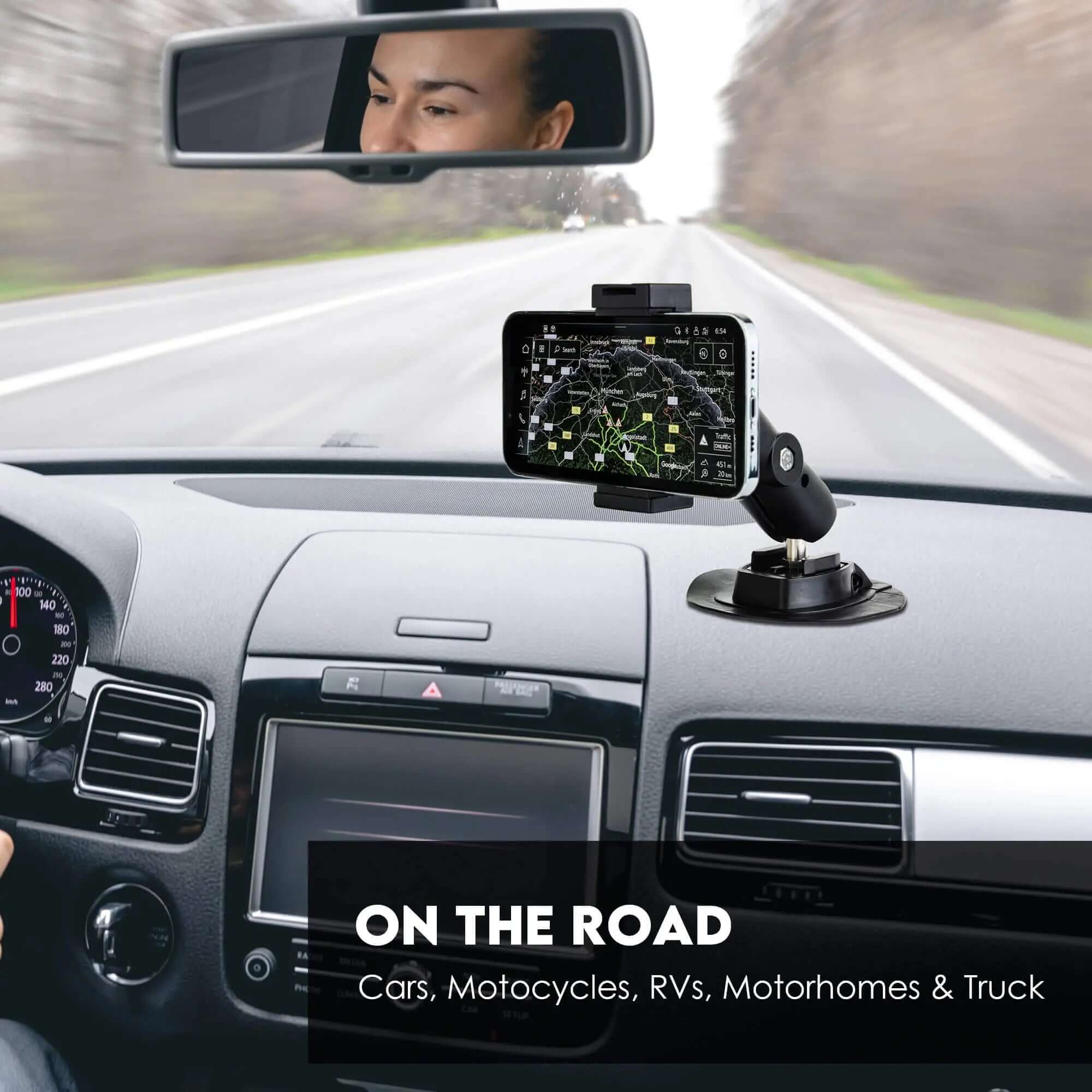 1-inch ball mount with adhesive base holding phone/GPS on car dashboard, road trip navigation