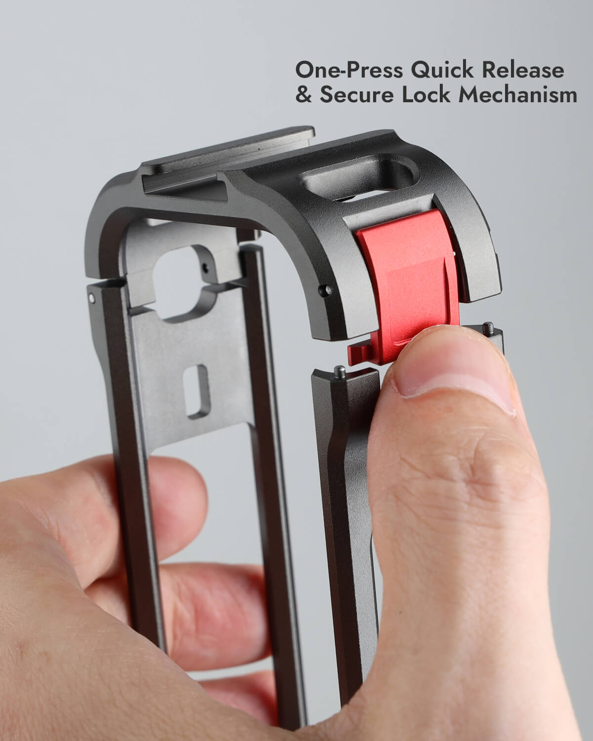 Thumb pressing red one-press quick release latch on POWRIG Insta360 X6 cage
