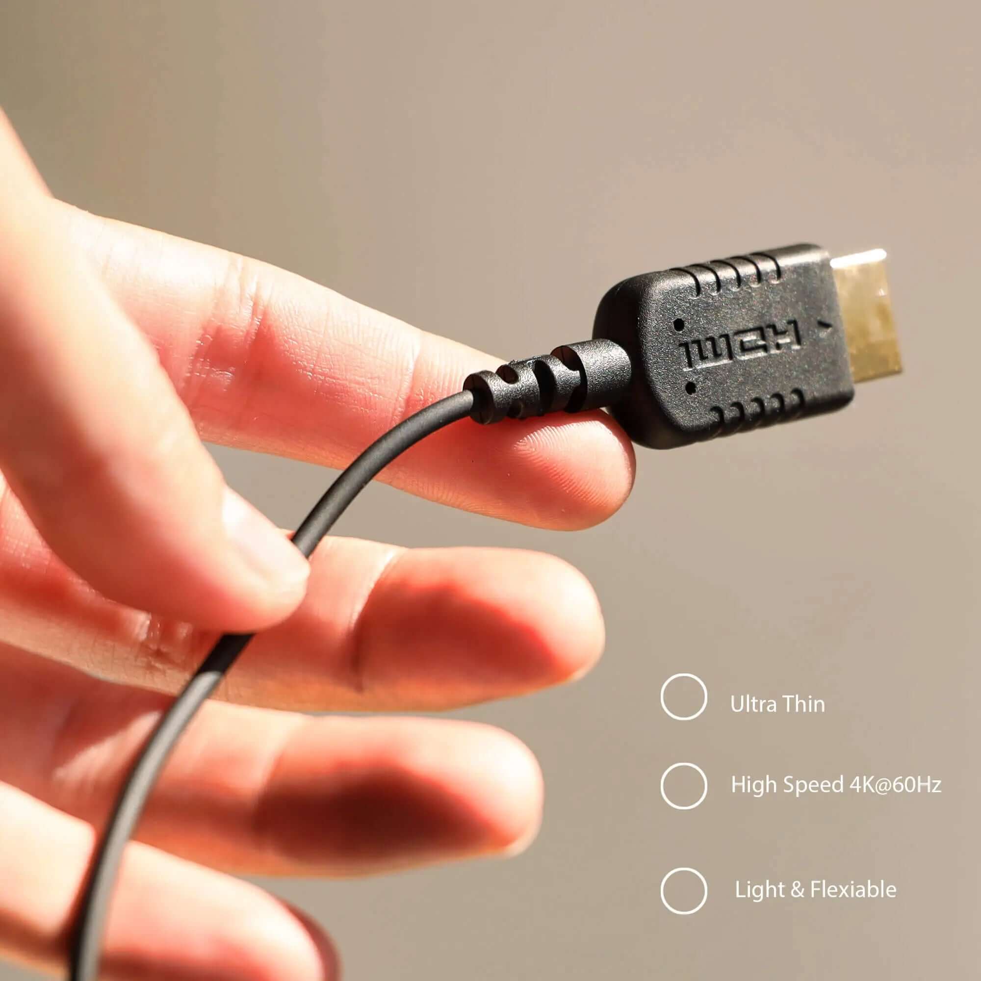 Ultra-Thin High-Speed HDMI Cable in Hand, Lightweight & Flexible Design, Supports 4K 60Hz for Cameras/Monitors